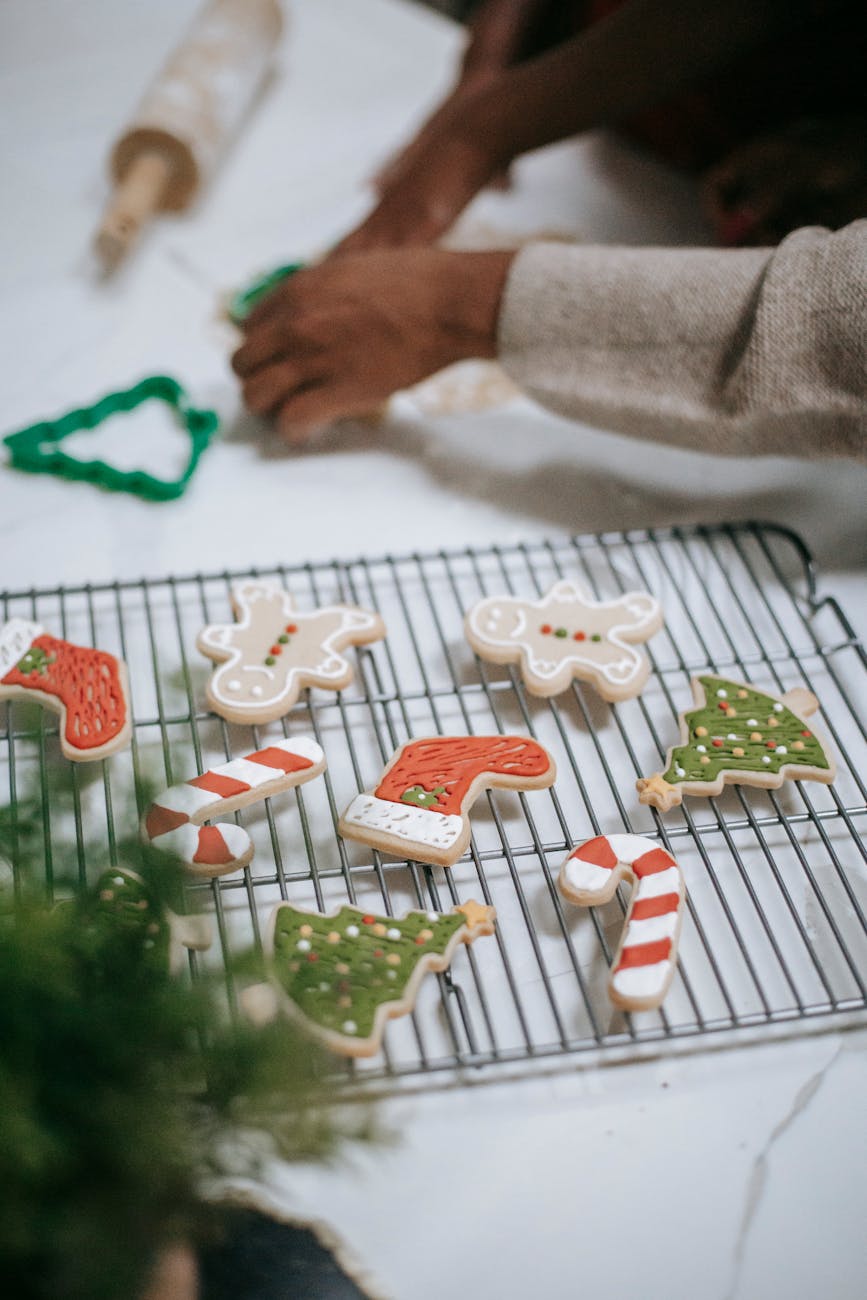 preparing iced christmas cookies